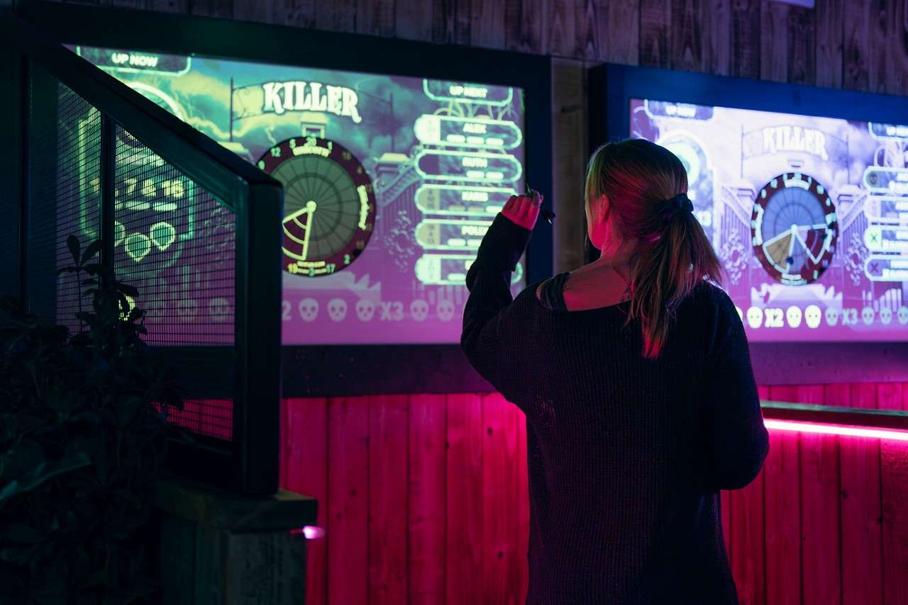 woman playing darts