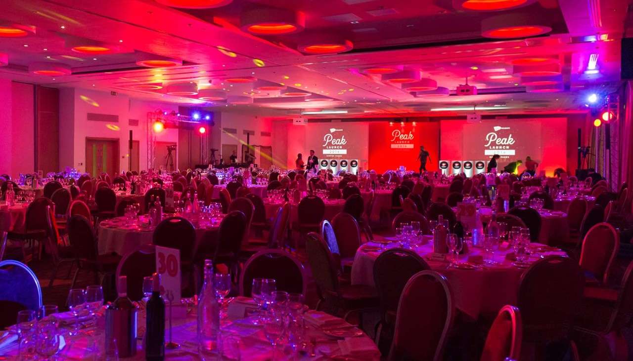 Event venue with red mood lighting for Virgin Holidays