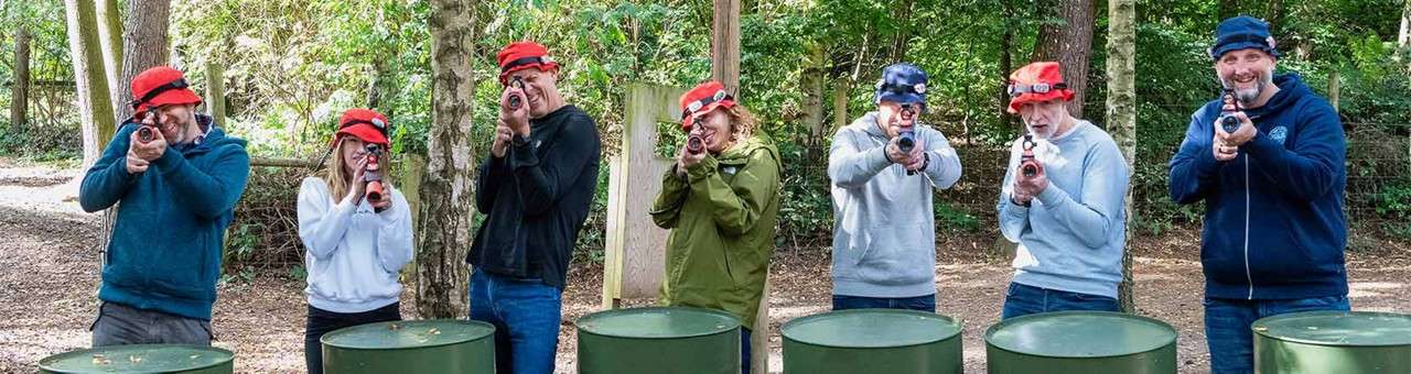 Team of delegates playing laser combat.