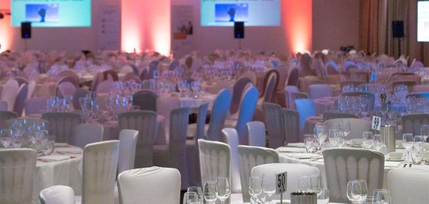 Guests sat around a table at an award ceremony