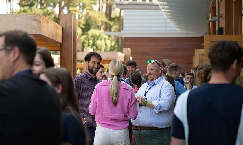 Delegates stood talking on the terrace.