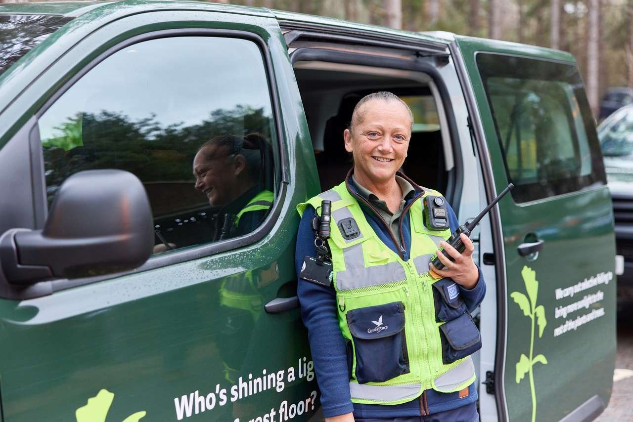 Housekeeping team driving a hybrid van.