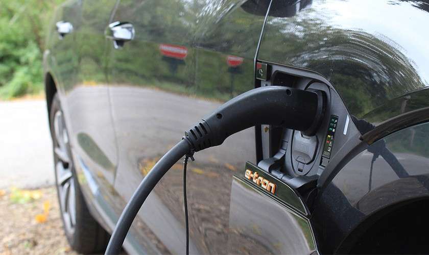 A car plugged in to an ev charger.