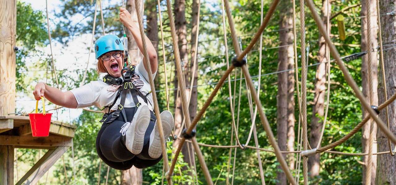 A woman on Aqua Tree Trek, part of Conquer the Forest.