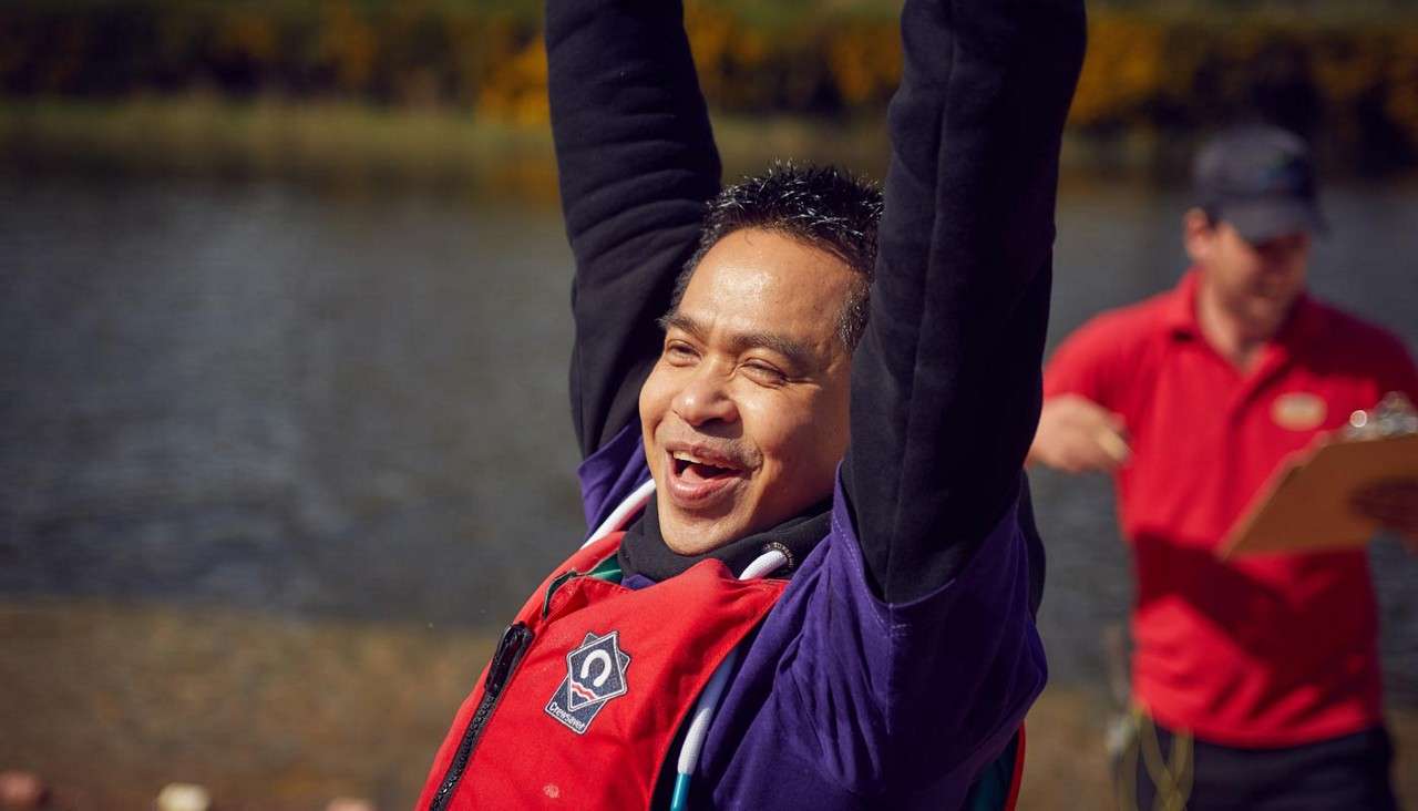 Man celebrating on the beach