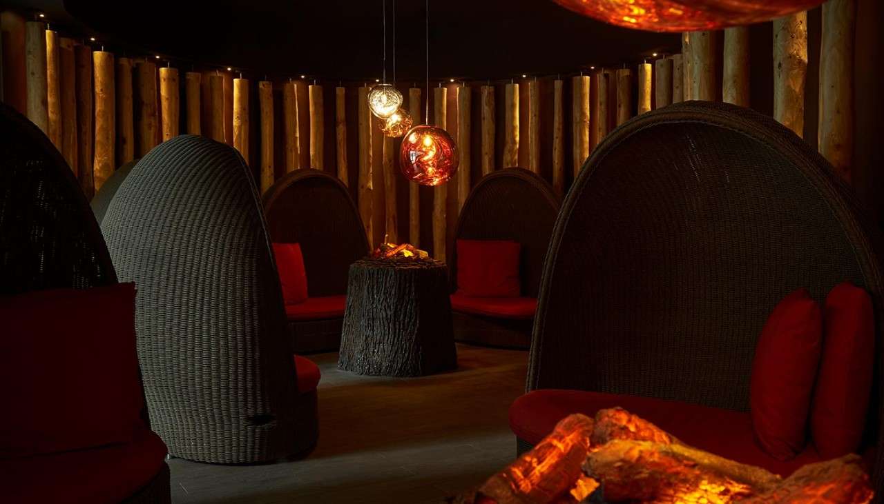 Fireside relax at Aqua Sana Spa with cosy seating around fake fires