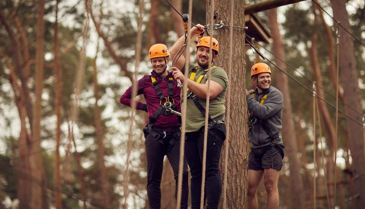 Group ready to descend along a zip line