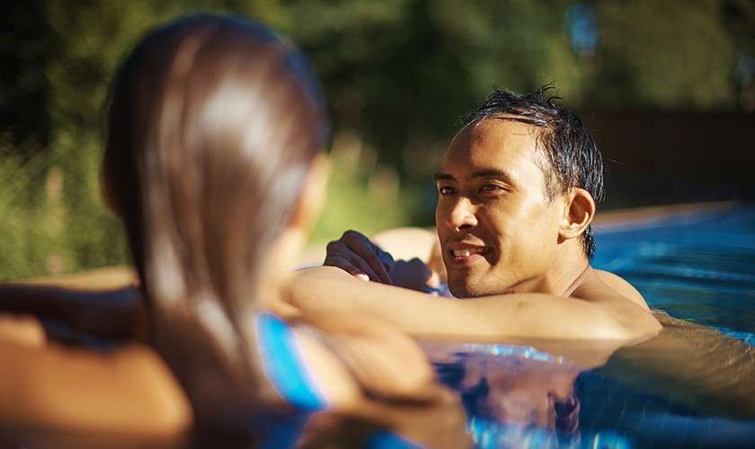 Women sat in a hot tub outside